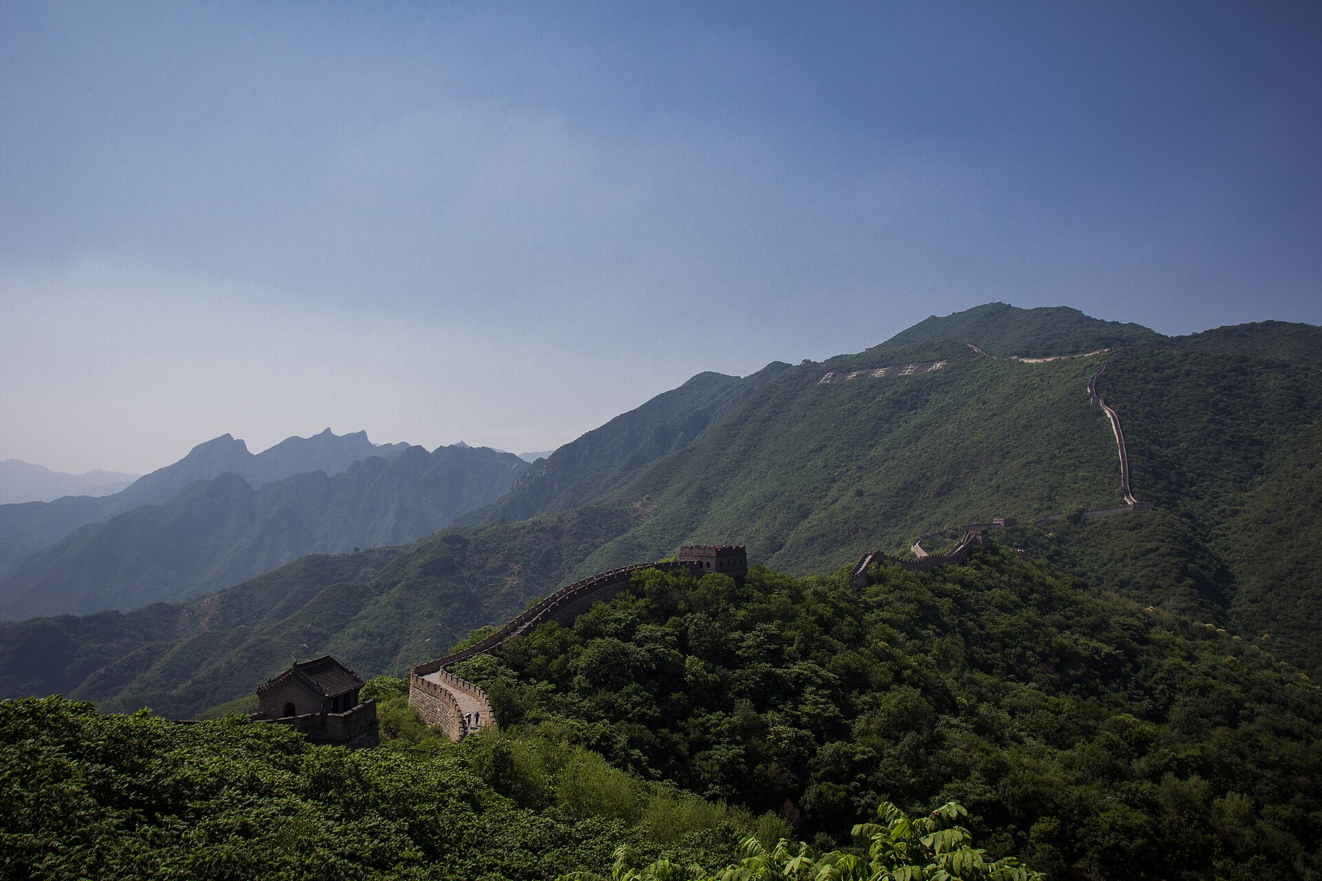 The Great Wall at Mutianyu winding over empty green ridges
