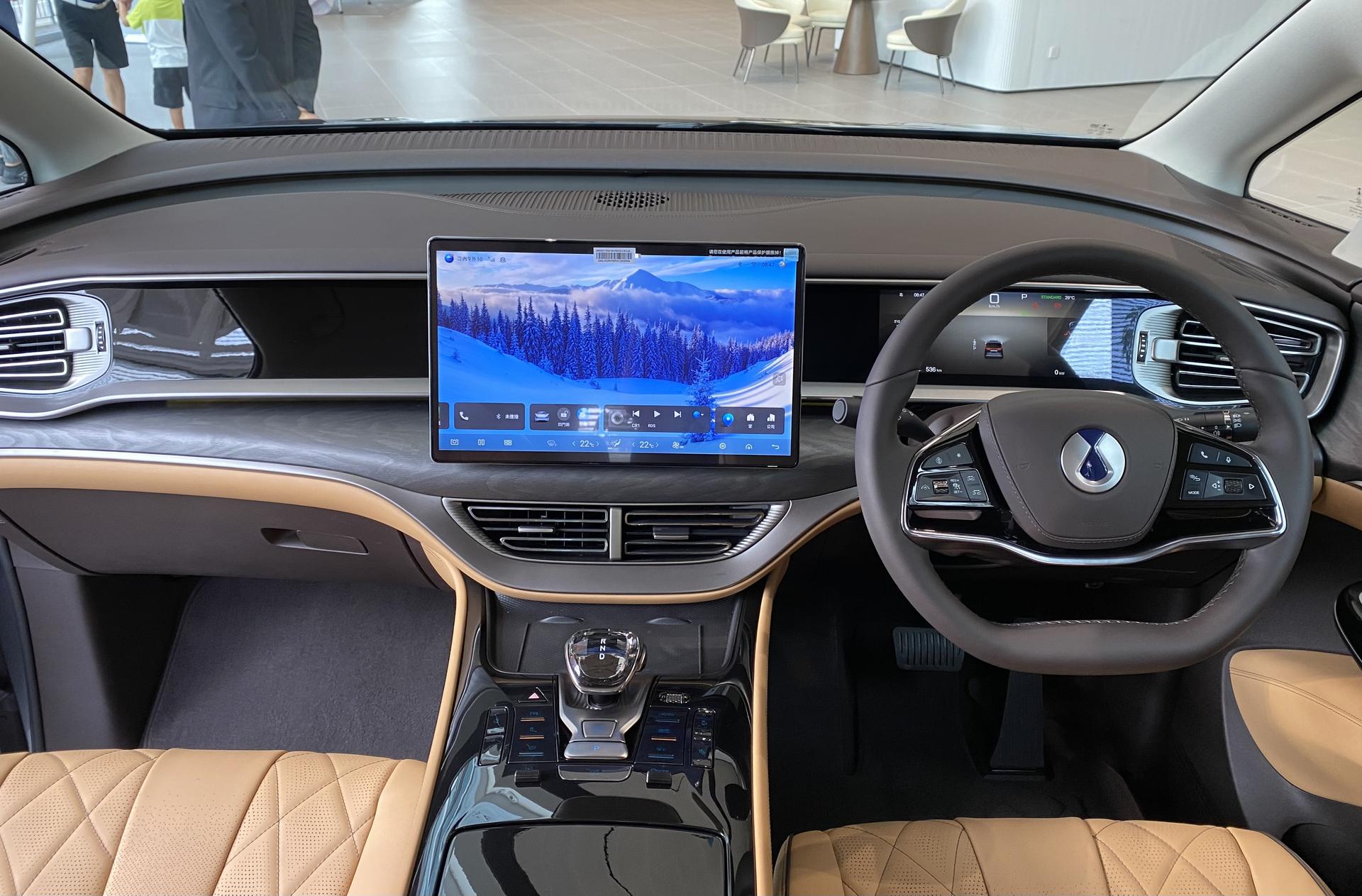 Denza D9 cabin with tan quilted leather and the wide central display