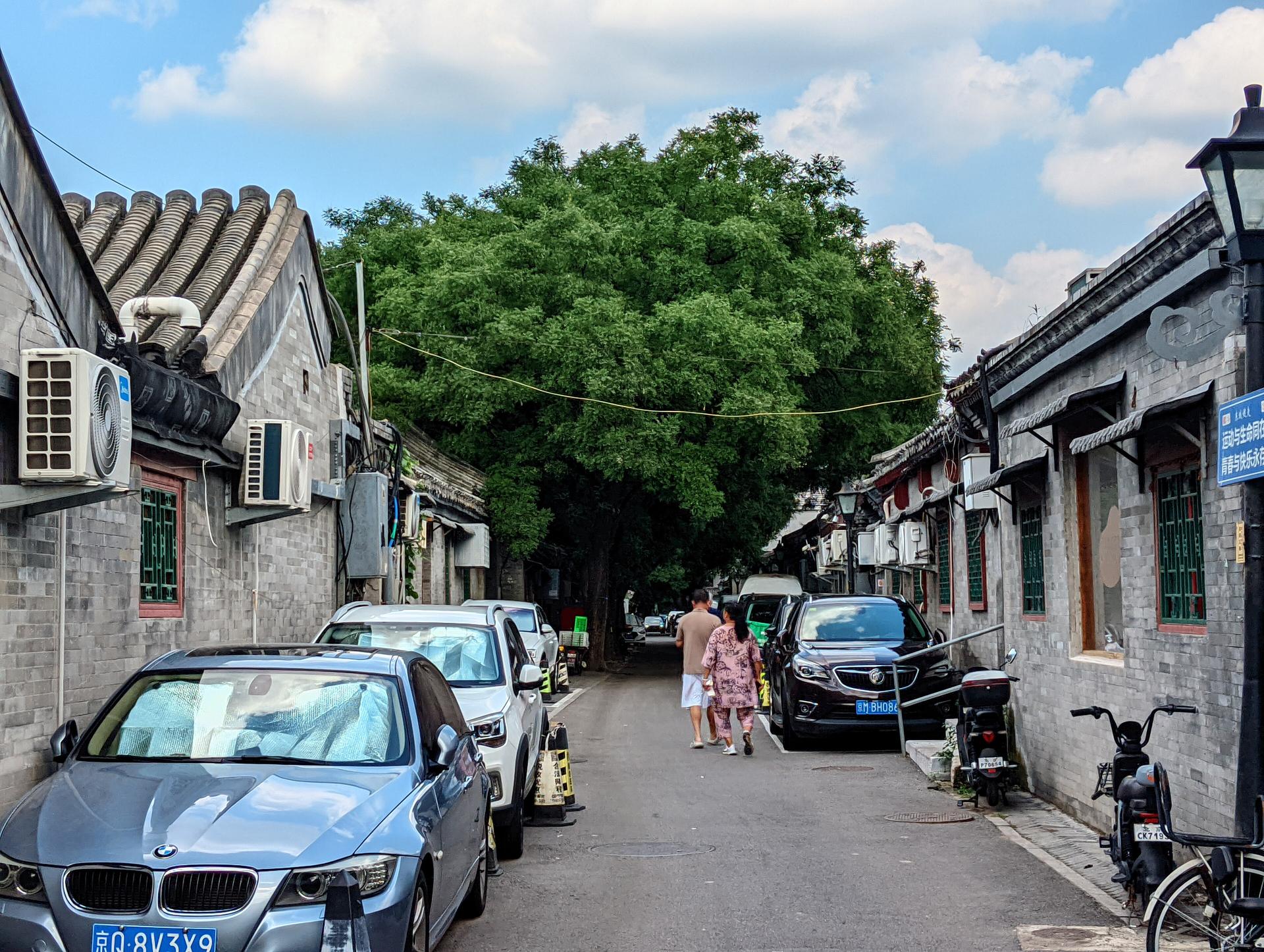 A grey-brick hutong lane in the Dongsi quarter, near Shijia Hutong