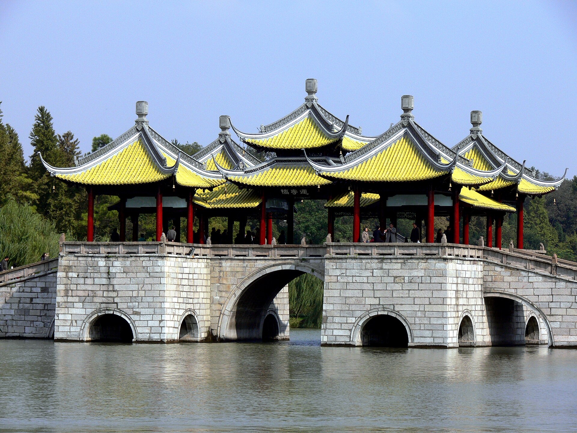 Yangzhou's Five-Pavilion Bridge in yellow tile, seen across the water of Slender West Lake