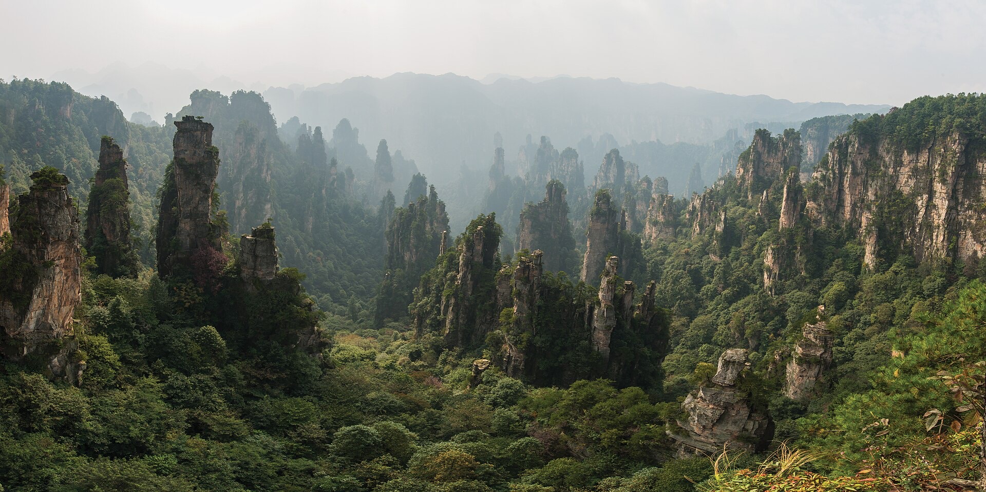 Quartz sandstone pillars of Tianzishan rising through haze in Zhangjiajie National Forest Park