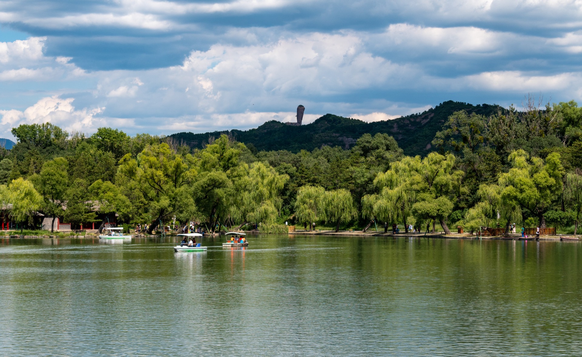 The lake district of the Chengde Mountain Resort with the hammer-shaped Qingchui peak on the ridge beyond