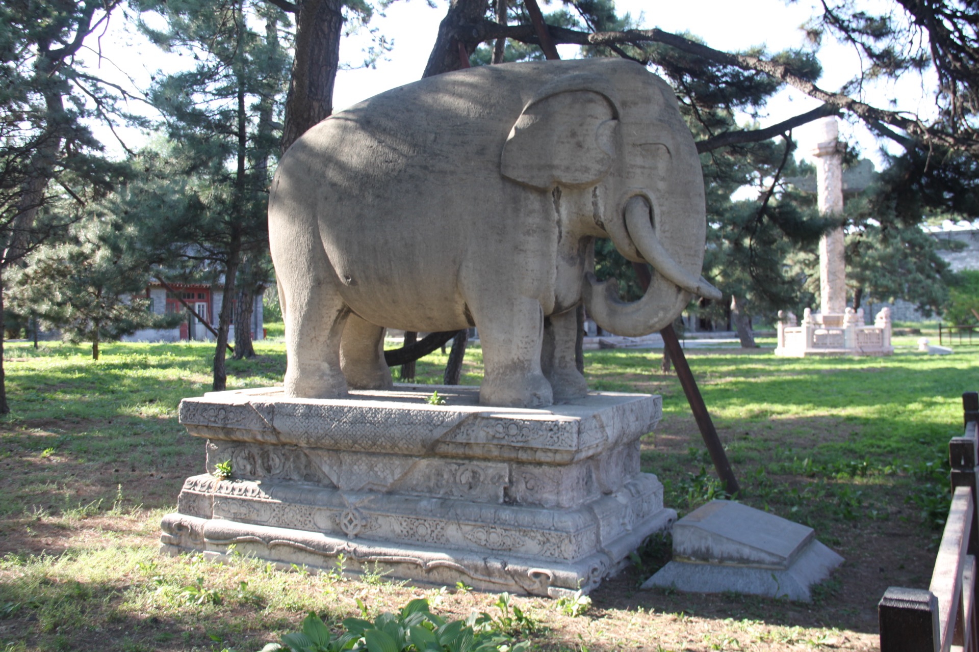 The stone elephant standing on carved pedestal along the spirit way of the Zhaoling tomb, Shenyang