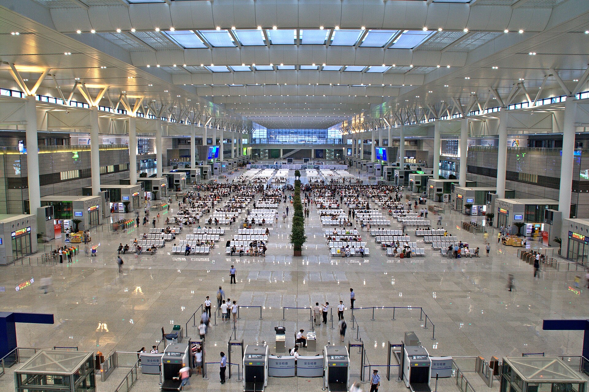 The vast departure hall of Shanghai Hongqiao station filled with rows of waiting passengers