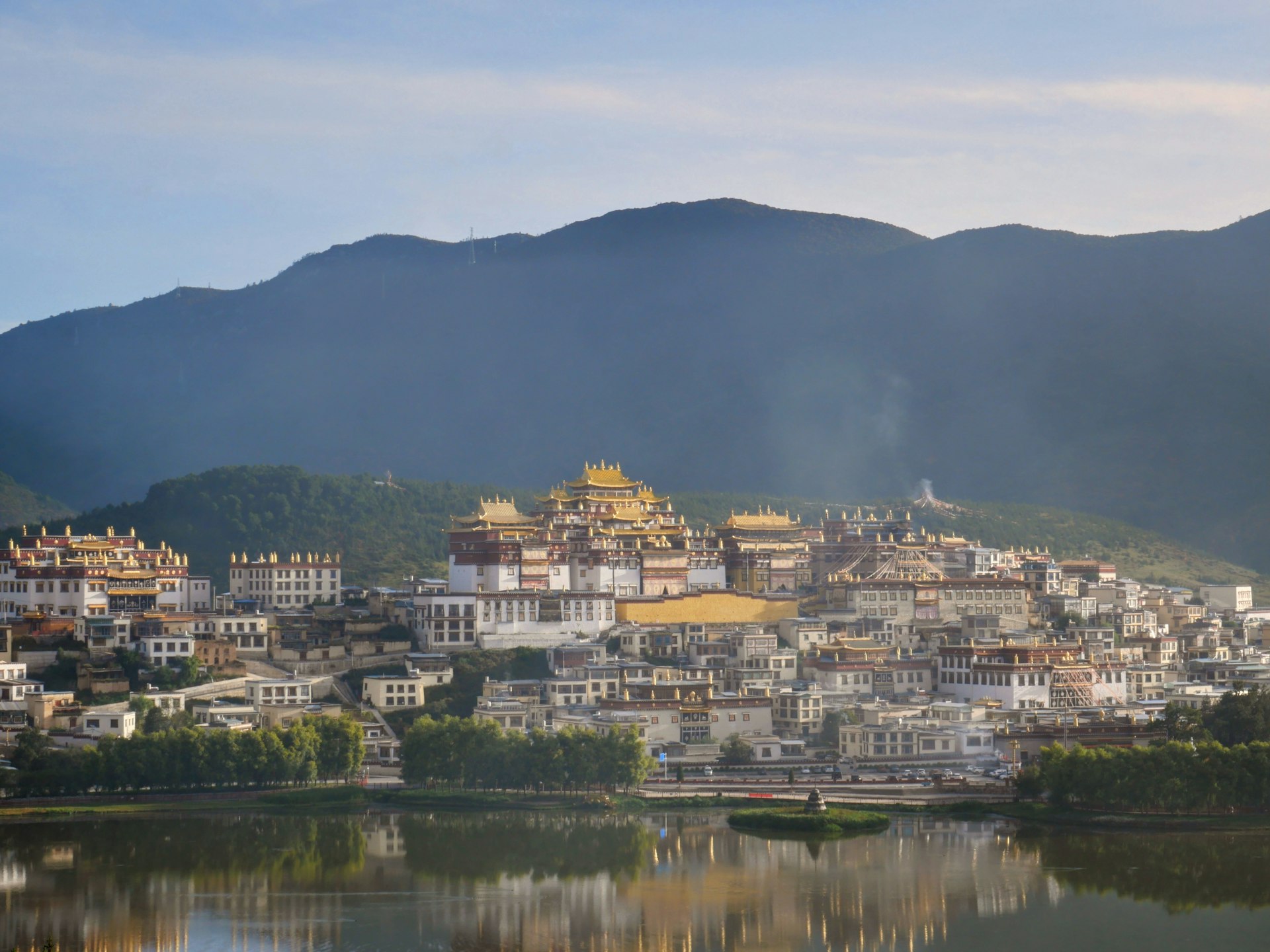 Songzanlin monastery at dawn, gilded roofs and incense smoke above its marsh