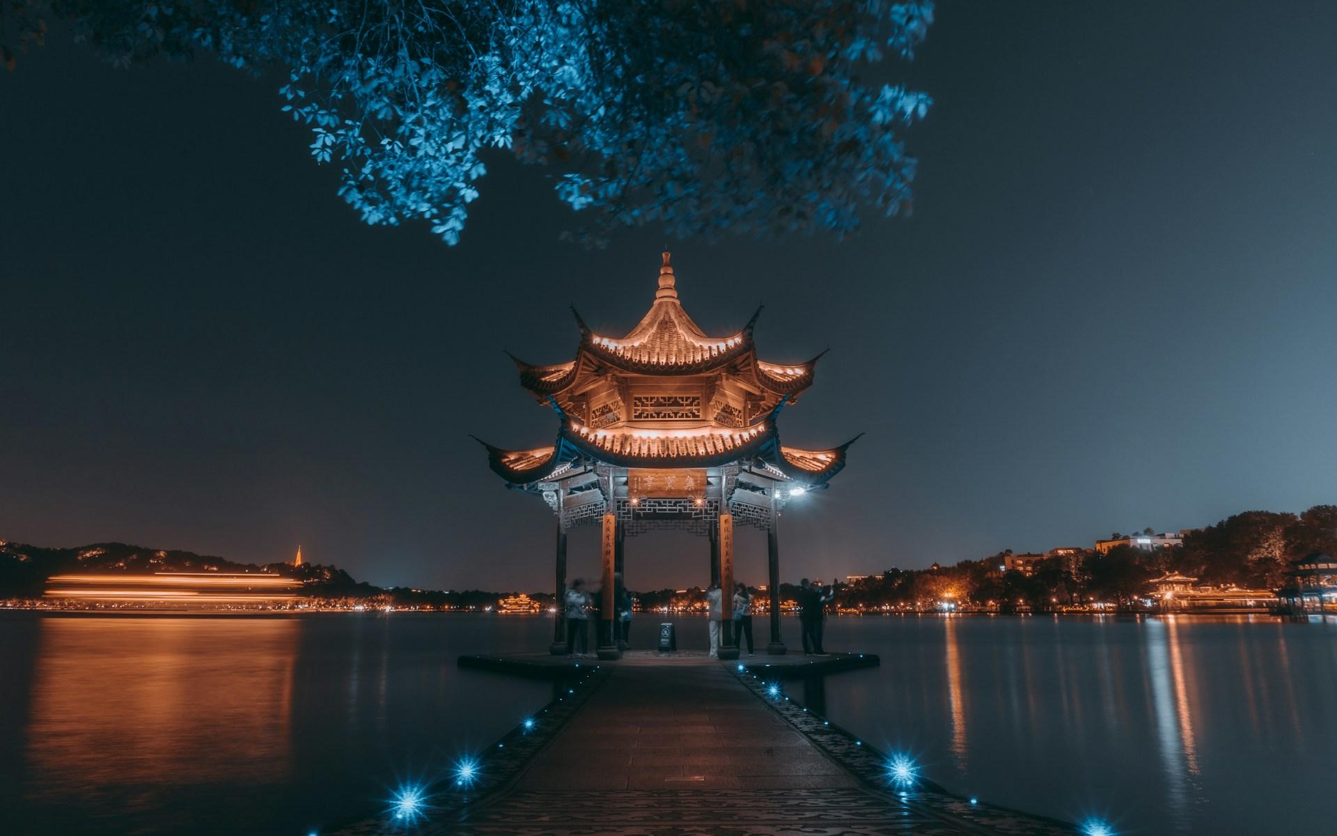 Sunset over West Lake with the Leifeng Pagoda in silhouette